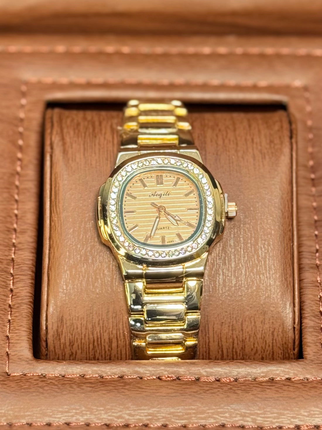 Wristive Female Patek Nautilus-Inspired Rose Dial, Golden Bracelet with Crystal Bezel